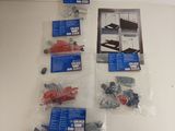 a lot of screws, screws, and other items on the table