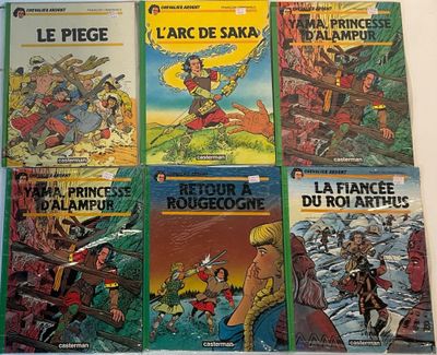 several children ' s books are lined up on a white surface