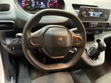 the interior of a car with a steering wheel and dashboard controls