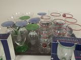 a tray of wine glasses and a tray of wine glasses on a table