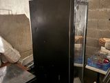 an image of a room with a refrigerator and other items