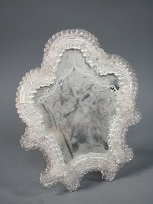 a picture of a mirror with a picture of a woman on it