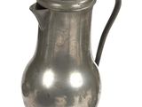 a silver pitcher with a handle on a white background