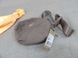 a bag that is sitting on the floor next to a tie