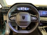 the interior of a car with a steering wheel and dashboard controls
