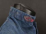 a close up of a pair of jeans on a mannequin