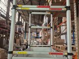 a picture of a ladder that is in a warehouse