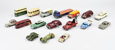 a lot of toy cars that are on a white surface