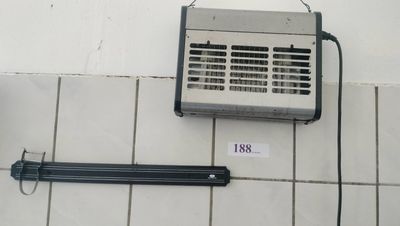a small air conditioner on the wall next to a heater