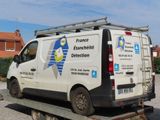 a van that is sitting on a flatbed trailer