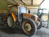a tractor that is parked inside of a building