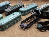 a lot of toy trains that are sitting on the floor