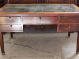 a desk that has a marble top on it