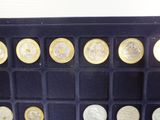 a picture of a display case with a lot of coins