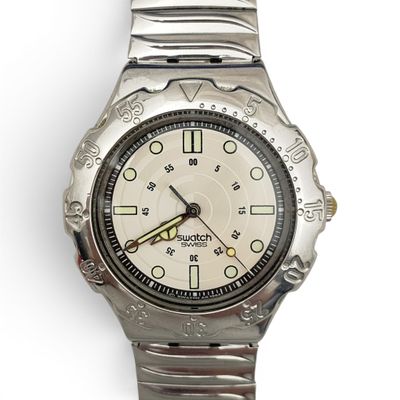a close up of a wrist watch on a white surface