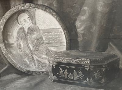 a black and white photo of a box and a picture of a woman