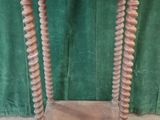 an old wooden table with a marble top on a green cloth