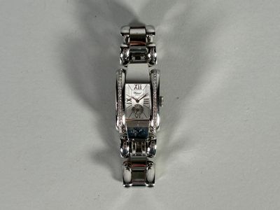 a watch that is sitting on a white surface