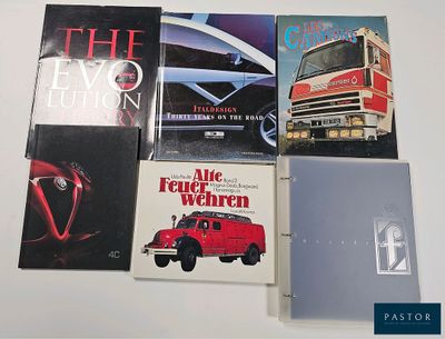 several books are stacked on top of each other on a table