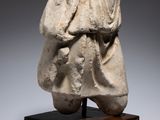 an image of a statue of a man holding a bag