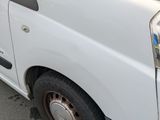 a white van parked on the side of the street