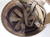 an overhead view of a helmet with a metal band around it