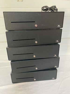 a black chest of drawers with a pair of shoes on top of it