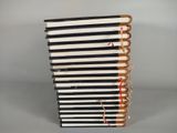 several books stacked on top of each other on a table