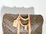Sac Keepall Louis Vuitton en toile Monogram et cuir