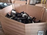 a cardboard box filled with assorted items in a warehouse