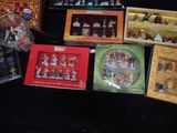 a lot of christmas figurines on display on the table