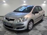 a picture of a silver toyota yaris parked in a showroom