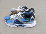 a close up of a pair of running shoes on the ground