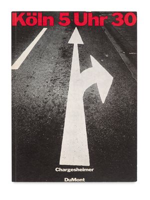 the cover of a book with a picture of a street with arrows pointing in different directions