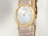 an image of a woman ' s wrist watch with a mother of pearl dial