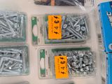 many different types of screws and screws on the table