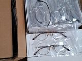 a box of glasses and a pair of glasses in it