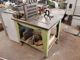 a table with a machine on it in a workshop