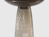 a glass mushroom with a brown base on a white background