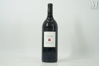 a bottle of wine that is sitting on a table