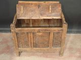 an old wooden chest with a drawer on it