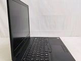an open laptop computer sitting on top of a white table
