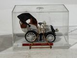 a small model of a car in a clear box