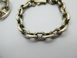 an image of a silver bracelet with a peace sign on it