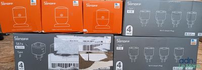 many boxes of wine glasses stacked on top of each other