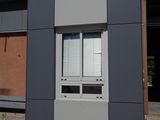 a small building with a door and windows on the side of it