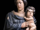 a statue of a woman holding a baby in her arms