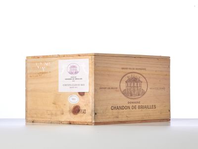 a wooden box with a label on it sitting on a table