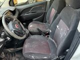 an image of a dirty car with the front seats down