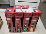 Plusieurs bouteilles de vin sont posées sur une table devant un panier